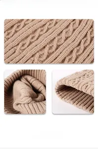Detailed view of chunky cable knit pattern and inner lining on khaki beanie hat