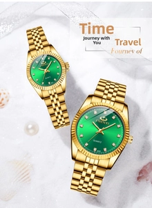 Detail of luxury gold couple watches with green sunray dials and diamond markers