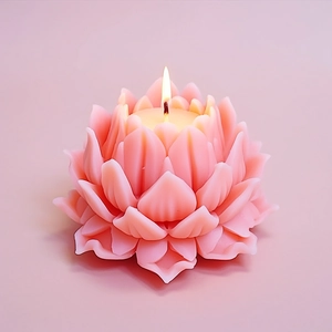 Pink lotus flower shaped silicone candle mold for handmade floral crafts with lit candle