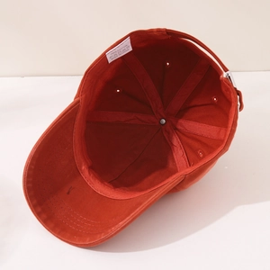 Internal view of the cotton baseball cap showing the 100% cotton label and stitching