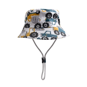 Detail of white cotton sun hat for kids featuring colorful construction vehicle prints
