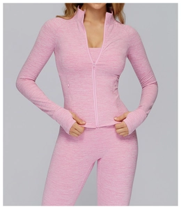 Detail view of pink space-dye sports jacket with high collar and thumbhole cuffs