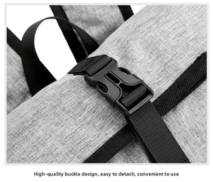 Detail of high-quality durable black plastic buckle and nylon strap on grey backpack
