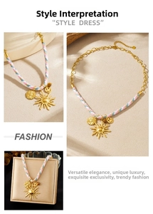 Close-up of bohemian colorful woven cord necklace with gold sunflower and smiley pendants