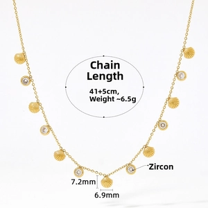 Detail view of gold necklace with shell charms and cubic zirconia including dimensions