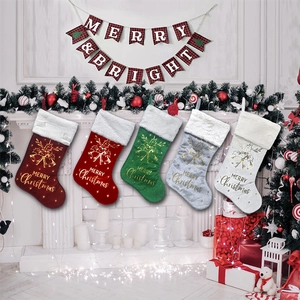 Set of 5 festive Christmas stockings with faux fur trim hanging on fireplace mantel