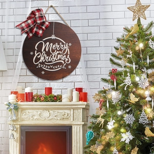 28cm round wooden Merry Christmas sign with red plaid bow hanging on a white wall