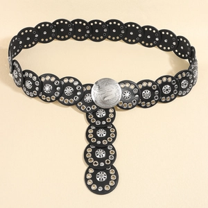 Detail of black punk leather belt featuring silver flower rivets and round disc links
