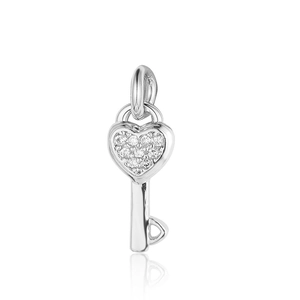 Macro shot of silver heart key pendant with sparkling pavé cubic zirconia inlay detail