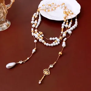 French pearl beaded necklace with gold key pendant and waterdrop pearl in vintage style
