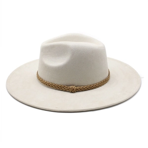 Detailed view of cream wide brim fedora with brown braided band and wool texture