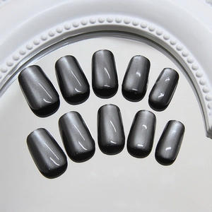 Minimalist black cat eye press-on nails with shiny metallic magnetic finish and reflective luster