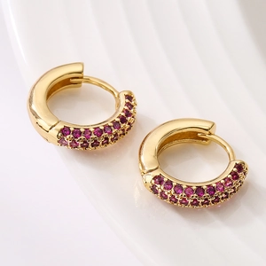 Mini gold-plated huggie hoop earrings featuring pavé-set magenta cubic zirconia stones