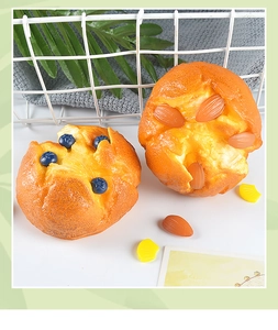 Close-up of realistic PU foam muffins with blueberry and almond toppings for bakery decor