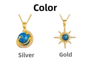 Detailed macro view of gold crescent moon and star pendants with blue crystal stones