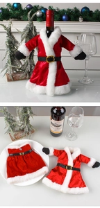 Close-up of Christmas wine bottle covers featuring red velvet dresses and Santa suits