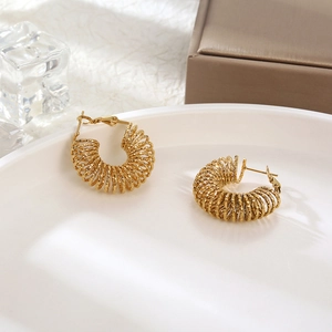 Retro gold spiral hoop earrings made of titanium steel with a vintage spring-like design