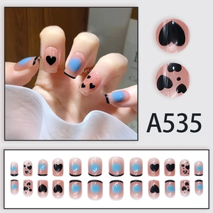 French blue smudge press-on nails with black heart patterns and tips, 24-piece full set