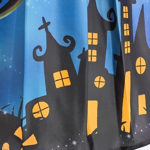 Detail of Halloween dress fabric featuring a blue starry night and gothic castle print