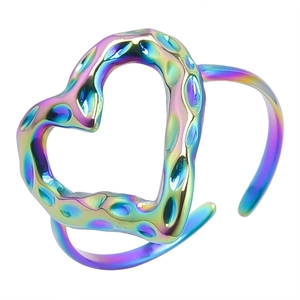 Macro detail of rainbow heart ring with hammered texture and vacuum plated finish