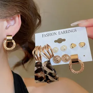 12-piece fashion earring set with faux pearls, gold hearts, and leopard print pendants