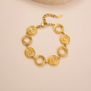 Detail of 18K gold plated bracelet showing lobster clasp and engraved 18K stamp tag