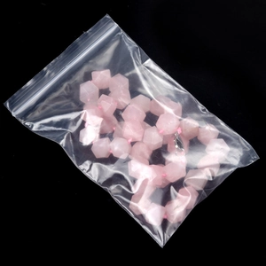 Pink natural quartz faceted bead necklace with matching thread in clear packaging