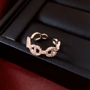 Adjustable 14K gold plated pig nose ring with cubic zirconia on black leather box