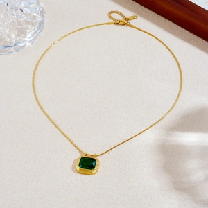 Gold stainless steel snake chain necklace with emerald green rectangular gemstone pendant