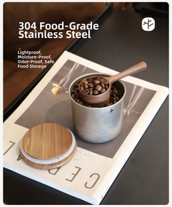 Detail of 304 stainless steel coffee canister with walnut lid and wooden spoon