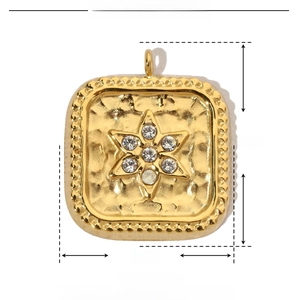 Detailed view of hammered gold square pendant with rhinestone star inlay and bead edge