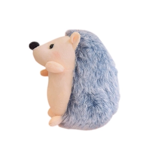 Cute hedgehog plush keychain with blue long fur and soft beige belly on white background