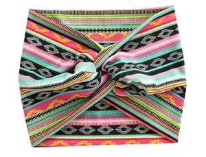 Detail of bohemian geometric pattern twist headband with vibrant multicolored textures