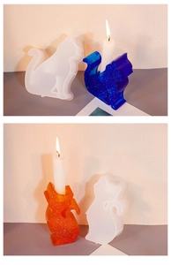 Detail view of cat-shaped silicone mold with finished blue and orange resin candle holders