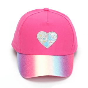Detail of rose pink kids baseball cap with rainbow sequin brim and silver heart patch