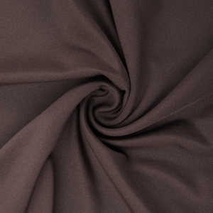 Macro detail of dark brown fine-knit fabric showing soft texture and draped spiral pleats