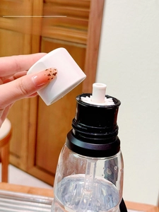 Detail of high-capacity plastic cup showing the straw design and clear bottle body