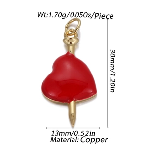 Detail of red heart pendant with gold nail through center showing precise dimensions