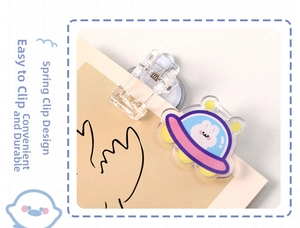 Close-up of a purple acrylic UFO spring clip with a cute rabbit holding onto paper