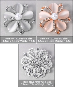 Detailed views of floral opal brooches and a luxury sparkling rhinestone snowflake pin