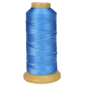 Blue braided nylon thread on yellow plastic spool for professional jewelry making and DIY crafts
