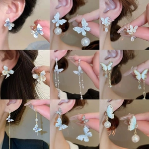 Boucles d'oreilles papillon élégantes avec revêtement iridescent, perles et strass
