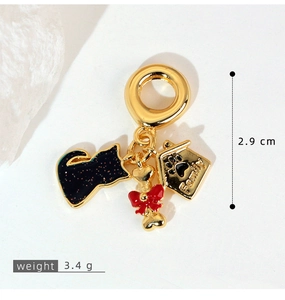 Detail of gold charms showing house with Family engraving and measurement of 2.9 cm