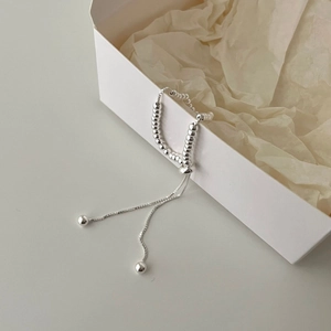 Detailed view of an adjustable S925 sterling silver beaded bracelet on a white gift box