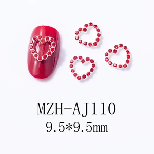 Macro view of 9.5mm red heart nail charms with silver metal base for nail art manicure