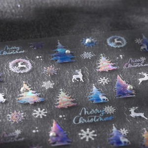 Christmas nail art stickers featuring iridescent deer, snowflakes, and festive trees