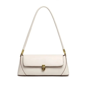 White minimalist baguette shoulder bag detail, elegant gold-tone lock hardware accent.