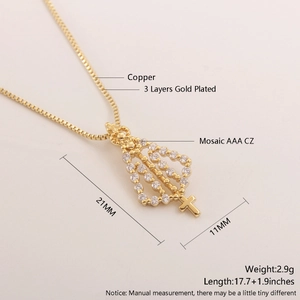 Detailed view of 18k gold plated hollow cross pendant with AAA cubic zirconia stones