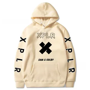 Detailed view of cream hoodie featuring black XPLR logo and cross print on the front