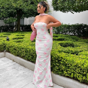 Detail of white floral tube dress with pink rose print and matching neck scarf tie